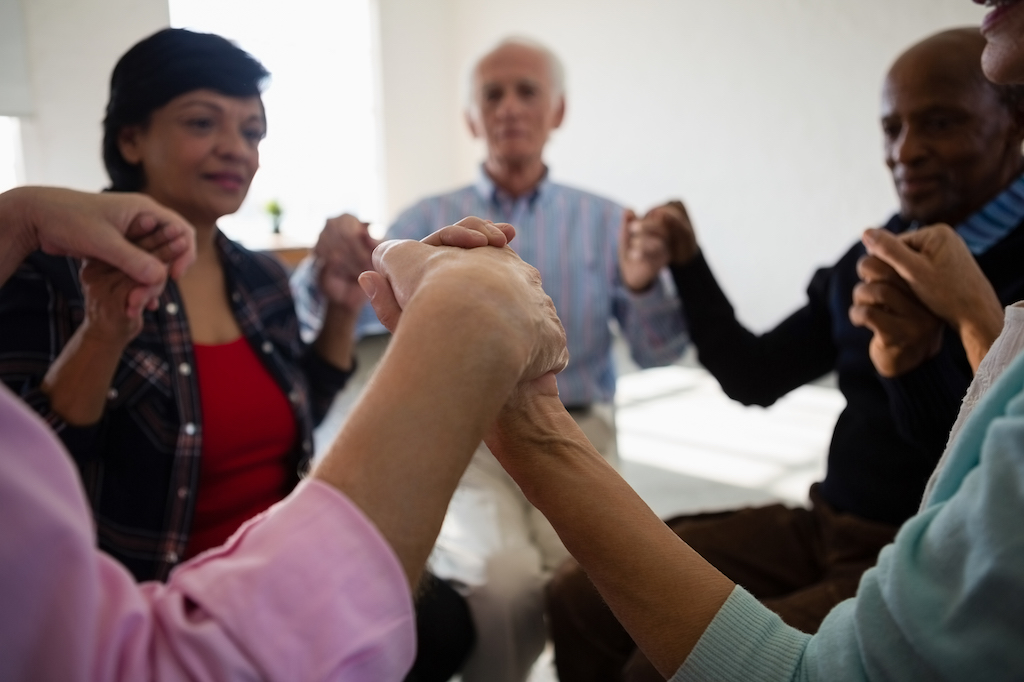 Support through recovery holding hands treatment