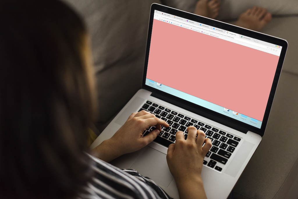 woman working with laptop in lap